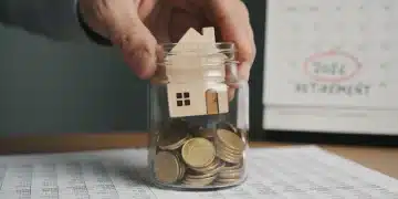 Hand placing house into jar of coins, representing protected retirement savings for 2026.